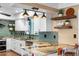 Modern kitchen with granite counters, stainless steel appliances, and stylish lighting at 5166 39Th S St, St Petersburg, FL 33711