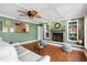 Living room with fireplace and built-in shelves, and a decorative coffered ceiling at 5166 39Th S St, St Petersburg, FL 33711