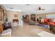 Open-concept living area with tile floors, neutral walls, and multiple seating arrangements at 5166 39Th S St, St Petersburg, FL 33711