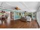 Spacious living room with hardwood floors, fireplace, and views to the backyard at 5166 39Th S St, St Petersburg, FL 33711