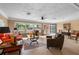 Bright living room featuring tile floors, large windows, and a comfortable seating area at 5166 39Th S St, St Petersburg, FL 33711