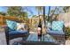 Relaxing outdoor seating area with comfortable cushions, decorative pillows, and a bottle of wine at 5166 39Th S St, St Petersburg, FL 33711