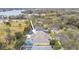 Aerial view of a single Gathering home with a screened in pool and lush landscaping at 15005 Lake Emerald Blvd, Tampa, FL 33618