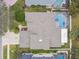Aerial view of the home showing the pool, roof, landscaping, and neighborhood at 15005 Lake Emerald Blvd, Tampa, FL 33618