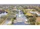 Aerial view of a single Gathering home with a screened in pool and lush landscaping at 15005 Lake Emerald Blvd, Tampa, FL 33618