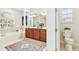 Spacious bathroom features a soaking tub, double vanity, and a separate toilet room at 15005 Lake Emerald Blvd, Tampa, FL 33618