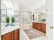 Bathroom boasts double vanity, soaking tub, separate shower, tile floors and stylish decor at 15005 Lake Emerald Blvd, Tampa, FL 33618