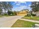 Charming two-story home with a well-manicured lawn and a spacious two car garage at 15005 Lake Emerald Blvd, Tampa, FL 33618