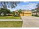 Charming two-story home with a well-manicured lawn and a spacious two car garage at 15005 Lake Emerald Blvd, Tampa, FL 33618