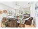 Large living room with a fireplace, bar area, comfortable seating, and access to the backyard at 15005 Lake Emerald Blvd, Tampa, FL 33618