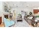 Spacious living room with a fireplace, comfortable seating, and ample natural light at 15005 Lake Emerald Blvd, Tampa, FL 33618