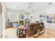 Bright and airy living room with a fireplace, comfortable seating, and hardwood floors at 15005 Lake Emerald Blvd, Tampa, FL 33618
