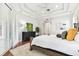 Bright main bedroom featuring hardwood floors, natural light and a tray ceiling at 15005 Lake Emerald Blvd, Tampa, FL 33618