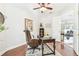 Cozy office space featuring hardwood floors, a vintage desk, and bright natural light near the entry at 15005 Lake Emerald Blvd, Tampa, FL 33618