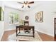 Bright office space featuring hardwood floors, natural light and a ceiling fan at 15005 Lake Emerald Blvd, Tampa, FL 33618