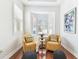 Charming seating area featuring hardwood floors, neutral colors, and bay windows at 15005 Lake Emerald Blvd, Tampa, FL 33618