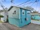 View of the back of the home with a fully-fenced yard for outdoor living at 3030 5Th N Ave, St Petersburg, FL 33713