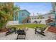 Cozy backyard with a fire pit and Adirondack chairs, great for outdoor entertaining at 3030 5Th N Ave, St Petersburg, FL 33713