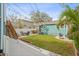 Backyard space with a deck, green grass and a stone patio with furniture at 3030 5Th N Ave, St Petersburg, FL 33713