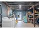 Basement laundry area with washer, dryer, and storage shelving at 3030 5Th N Ave, St Petersburg, FL 33713