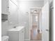 Well-lit bathroom with a vanity, medicine cabinet, and tiled floor at 3030 5Th N Ave, St Petersburg, FL 33713