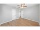 Bright bedroom featuring wood-look flooring and neutral walls with two entry doors at 3030 5Th N Ave, St Petersburg, FL 33713