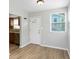Cozy dining area with hardwood floors and natural light streaming through windows at 3030 5Th N Ave, St Petersburg, FL 33713