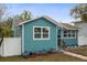 Recently renovated home with an eye-catching exterior, trimmed hedges, and manicured flower beds at 3030 5Th N Ave, St Petersburg, FL 33713