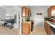 View of kitchen featuring wood cabinetry, stainless steel appliances, and an open layout at 3030 5Th N Ave, St Petersburg, FL 33713