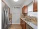 Bright kitchen featuring stainless steel appliances, granite countertops, and a modern mosaic backsplash with natural light at 3030 5Th N Ave, St Petersburg, FL 33713