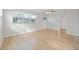 Bright and airy living room featuring hardwood flooring and large windows at 3030 5Th N Ave, St Petersburg, FL 33713
