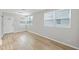Bright and airy living room featuring hardwood flooring and large windows at 3030 5Th N Ave, St Petersburg, FL 33713