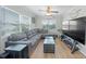 Comfortable living room with natural light, ceiling fan, and hardwood floors at 3030 5Th N Ave, St Petersburg, FL 33713
