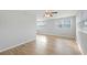 Spacious living room with light hardwood flooring and abundant natural light at 3030 5Th N Ave, St Petersburg, FL 33713
