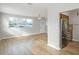 Open-concept living room leading into a modern kitchen with stainless steel appliances at 3030 5Th N Ave, St Petersburg, FL 33713