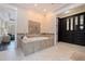 A stylish bathroom with a jacuzzi tub and adjacent to a custom designed walk-in closet at 310 8Th N Ave, St Petersburg, FL 33701