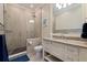 Modern bathroom with tiled shower, sleek vanity, and neutral color palette at 310 8Th N Ave, St Petersburg, FL 33701