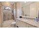 Bathroom with granite counters, bath and shower and decorative tiled wall at 310 8Th N Ave, St Petersburg, FL 33701