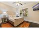 Cozy bedroom featuring stylish decor, a large window, and a mounted television at 310 8Th N Ave, St Petersburg, FL 33701