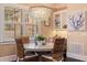 Cozy dining nook with wicker chairs, pendant lighting, and a view at 310 8Th N Ave, St Petersburg, FL 33701