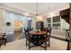 Well-appointed dining area with dark wood table and seating, adjacent to a bedroom and wine storage at 310 8Th N Ave, St Petersburg, FL 33701