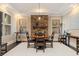 Charming dining area featuring a stone accent wall, a round table, and warm natural light at 310 8Th N Ave, St Petersburg, FL 33701