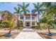 Stunning two-story home with a welcoming front porch and lush tropical landscaping at 310 8Th N Ave, St Petersburg, FL 33701
