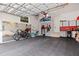 Spacious two car garage with storage, work bench, and shelving systems at 310 8Th N Ave, St Petersburg, FL 33701