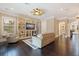 Inviting living room featuring hardwood floors, built-in shelving, and a decorative ceiling fan at 310 8Th N Ave, St Petersburg, FL 33701
