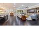 Expansive living room featuring a built-in entertainment center, dark floors, and ample natural light at 310 8Th N Ave, St Petersburg, FL 33701