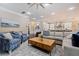 Elegant living area with comfortable seating, stylish rug, and an open layout to the kitchen at 310 8Th N Ave, St Petersburg, FL 33701