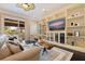 Cozy living room with built-in shelving, a ceiling fan, and sliding doors to the outside porch at 310 8Th N Ave, St Petersburg, FL 33701