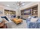 Cozy living room featuring comfortable seating, a decorative coffee table, and a ceiling fan at 310 8Th N Ave, St Petersburg, FL 33701