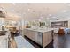Open-concept kitchen featuring an island, stainless steel appliances, and a living area at 310 8Th N Ave, St Petersburg, FL 33701